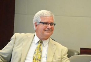 Raymond Warren as an assistant public defender during a break in a trial a few years ago in a Flagler County courthouse courtroom. (© FlaglerLive)