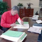 President Reagan signing the Fiscal Year 1989 Appropriations Bills at his desk in the Oval Office in October 1988. (White House)