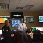 Sheriff Rick Staly and Chief Paul Bovino explaining the Real-Time Crime Center, operating since spring, and shown to reporters today. (© FlaglerLive)