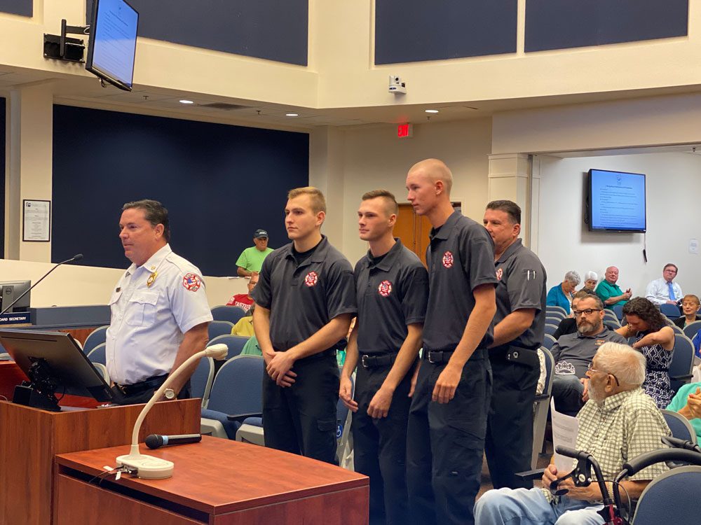 Noah Dunaway, Dylan Cronk and Beau Kruithoff, with Chief Don petito on one side and Deputy Chief Joe King behind them, as they appeared before the County Commission this morning, in a picture taken by Commissioner Joe Mullins.