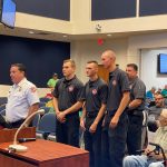 Noah Dunaway, Dylan Cronk and Beau Kruithoff, with Chief Don petito on one side and Deputy Chief Joe King behind them, as they appeared before the County Commission this morning, in a picture taken by Commissioner Joe Mullins.