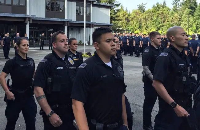 Police recruits gather at the morning flag ceremony at the Washington State Criminal Justice Training Commission. The recruits are trained in mental health and de-escalation. (Pew Charitable Trusts)