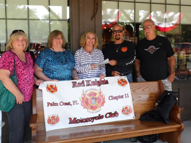Red Knights Motorcycle Club members, from left: Cindy Baker (treasurer), Janet Popp (of the Shands Burn Center), Laura Roberson (Shands), Thomas baker (president) and Chet Pietschker (vice presdident). 