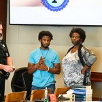 L'Darius Smith after the verdict with his attorney, Assistant Public Defender Regina Nunnally, and Greg Weston, a sheriff's deputy. (© FlaglerLive)