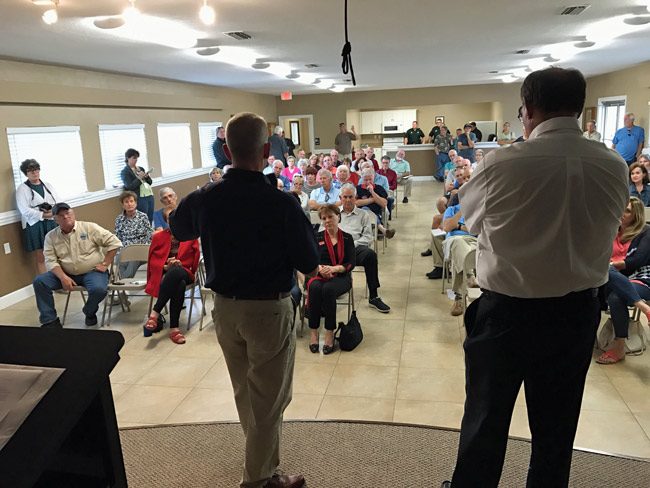 A sizable crowd turned out on short notice for a town hall meeting on beach repairs and short-term vacation rental issues affecting the Hammoc Saturday afternoon at the Hammock Community Center. The town hall meeting was hosted by Rep. Paul Renner, left, and County Commissioner Greg Hansen. (© FlaglerLive)