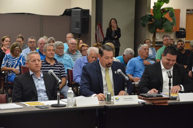 Rep. Paul Renner, left, County Administrator Craig Coffey and Sen. Travis Hutson at today's workshop with the County Commission on short-term rental regulations, and what the Legislature may do to weaken those regulations in January. Some 65 people attended the workshop, not including county staffers. (c FlaglerLive)