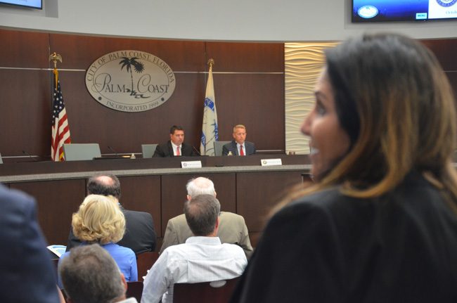 Sen. Travis Hutson, left, and Rep. Paul Renner, at October's local legislative delegation meeting. Palm Coast Mayor Milissa Holland, in the foreground, has voiced opposition, along with the city council, to a proposal by Paul Renner to expand the role of surgery recovery centers. (c FlaglerLive)