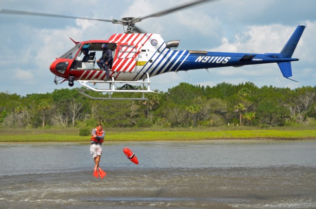 Ten members of Flagler County Fire Rescue and five Flagkler County Sheriff's deputies jumped out of Fire Flight up to five times each today in  a rescue training operation over the Intracoastal that will vastly enhance water-rescue capabilities in the county. Click on the image for larger view. (© FlaglerLive)