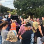 Unhappy Flagler Beach residents gathered at the corner of South Daytona Avenue and South 15th Street Thursday evening to hear a city official explain the project digging swales at the south end of town. It did not go as planned. (© FlaglerLive)