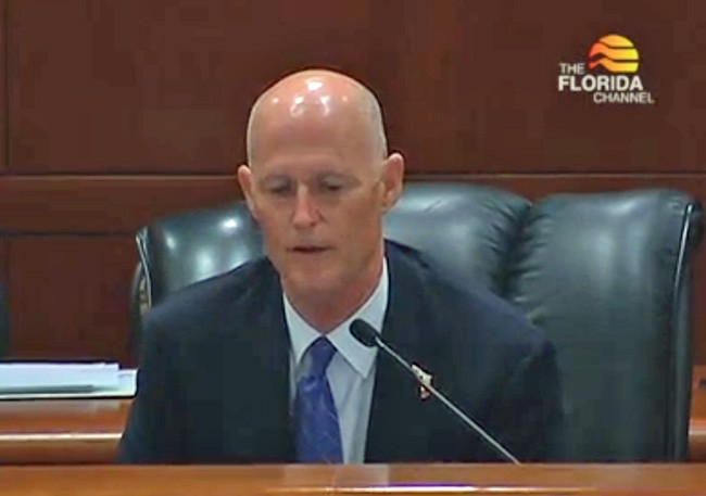 Rick Scott at a cabinet meeting earlier this month, in a still from a Florida Channel broadcast. 