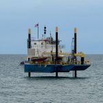 An exploratory rig offshore of South 6th Street in Flagler Beach on May 22, the landing location of planned undersea cables that will connect to a Cable Landing Station in Flagler Beach before snaking to a data center in Palm Coast. (© FlaglerLive)