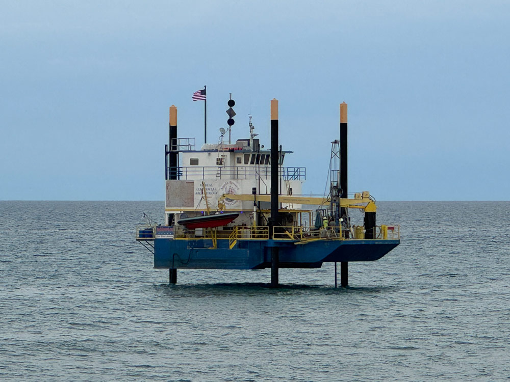 An exploratory rig offshore of South 6th Street in Flagler Beach on May 22, the landing location of planned undersea cables that will connect to a Cable Landing Station in Flagler Beach before snaking to a data center in Palm Coast. (© FlaglerLive)