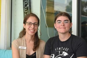 Erica Rivera, left, and Eryn Harris, president and vice president of Flagler Pride, whose secretary is (© FlaglerLive)