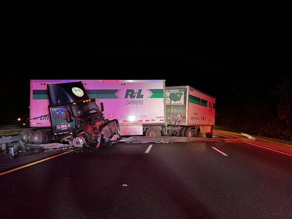 The tractor trailer crashed through the center guardrail and jackknifed across all three northbound lanes of I-95 early this morning. (PCFD)