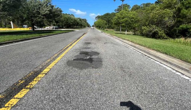 Royal Palms Parkway has gone ragged lately, but mostly because the city is rebuilding a wier nearby, and construction trucks have ravaged the road. (Palm Coast)