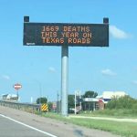 A roadside dynamic messaging sign in Texas, displaying the death toll from road crashes.