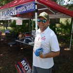 Rob Wood just outside the Will Furry campaign tent at the public library in Palm Coast this afternoon. Wood beat Furry, the incumbent, to win a seat on the Flagler County School Board. (© FlaglerLive)