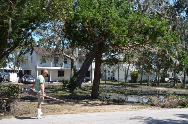 Robert Law has lived all his life in the house his father Bob Law built on the Intracoastal, on Lambert Avenue, in 1943. He said he's never seen anything like Monday's floods, which wiped out the first floor of his house, his car, and his motorcycle. A wheelbarrow sits in his house now, part of the clean-up efforts. Click on the image for larger view. (c FlaglerLive)