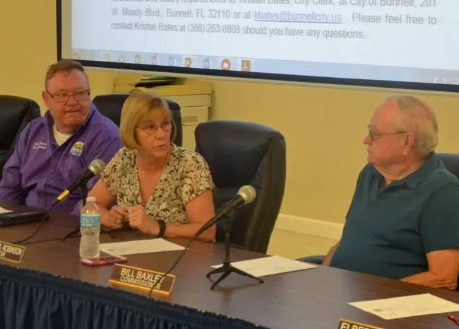Bunnell city commissioners are unhappy with the county. From left, John Ropgers, Mayor Catherine Robinson, and Bill Baxley. Not pictured were Donnie Nobles and Jan Reeger, who also voted for a resolution condemning the county's decision to locate a sheriff's building in Palm Coast. (© FlaglerLive)