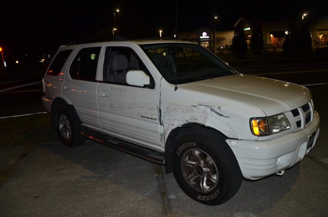 The motorcyclist struck the Isuzu Rodeo on its front, passenger side. (© FlaglerLive)