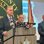 Roger Handberg, U.S. Attorney for Florida's Middle District, addressing the press last year with Sheriff Rick Staly, when they announced indictments in a fentanyl-related investigation. (© FlaglerLive)