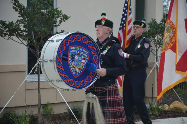 Retired cop Ron Reynolds, a member of the Police and Fire Pipes and Drums band, performing at Sheriff Rick Staly's swearing-in Tuesday. The group will be among the musical  performers at Donald Trump's presidntial inauguration in Washington on Jan. 20. You can help support the group's fund-raising for the trip here. (c FlaglerLive)