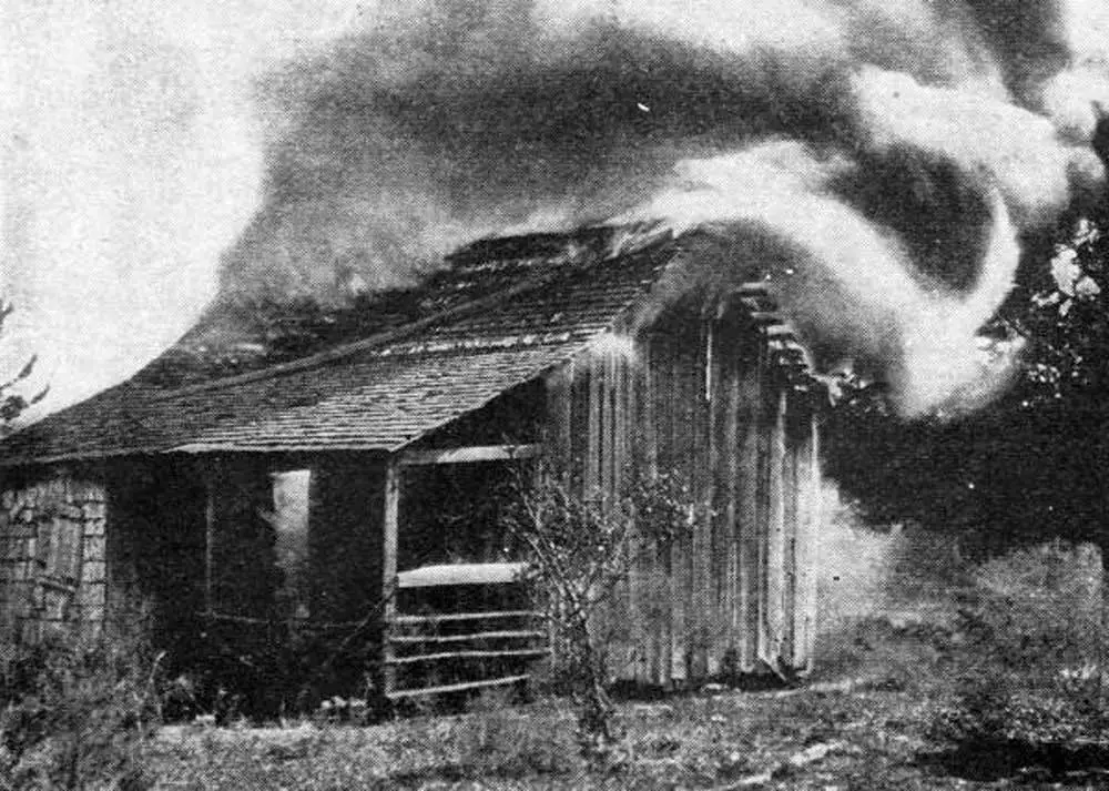 The deliberate burning of a house belonging to Black residents in Rosewood on Jan. 4, 1923. (Florida Memory)