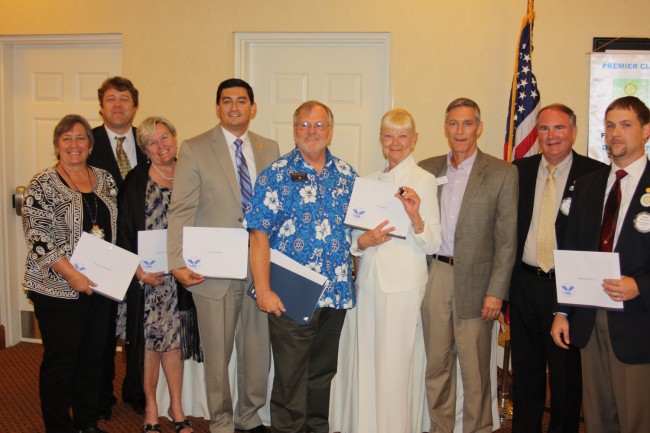 The President's Service Award recipients from left: Thea Hein-Mathen, John Poage, Maralee Walsh-McDaniel, John Skripko, DG John Brunner, Carol Sharp, Jay Gardner, President Rick Staly and Steve Barnier. (Rotary Club)