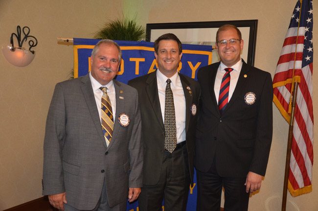 Three presidents: From left, President-Elect Tracy Loftus, President Jim Troiano, and Past-President Matthew Maxwell. (© FlaglerLive)