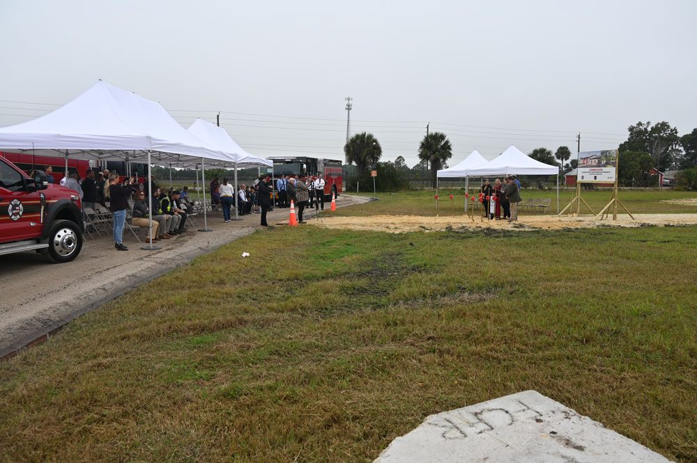 The five county commisisoners to the right marking the groundbreaking of Flagler County Fire Station 51 at County Road 305 and State Road 100 this morning. (© FlaglerLive)