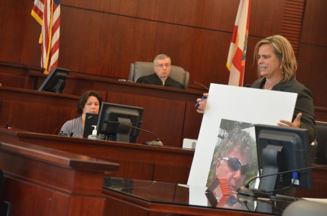 Then-Assistant State Attorney Jackie Roys held up an image of Dana Mulhall to the jury during Paul Miller's trial in 2013. Click on the image for larger view. (© FlaglerLive)