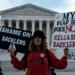 Grace Bisch, whose stepson died as a result of an overdose, protests outside the Supreme Court in December 2023.