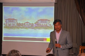 Salamander President Prem Devadas at the Hammock Conservation Coalition meeting Tuesday, with a rendition of the proposed development, as seen from beach level. Click on the image for larger view. (© FlaglerLive)