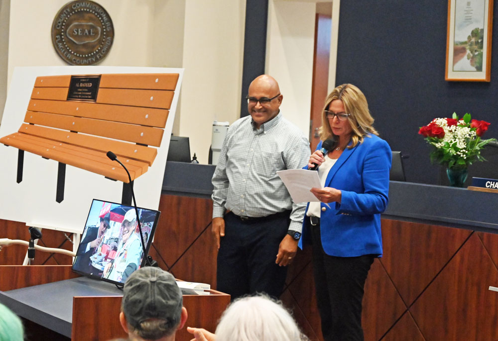 Jorge Salinas with Heidi Petito at a July send-off for Al Hadeed, the retiring county attorney. (© FlaglerLive)