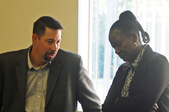 Deputy County Administrator Sally Sherman and Administrator Craig Coffey. (© FlaglerLive)