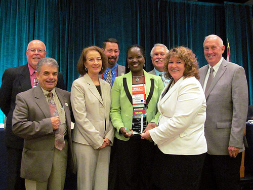 Back Row: Human Resources Director Joe Mayer, County Administrator Craig Coffey, Commissioners Frank Meeker and Charles Ericksen. Front Row County Commissioners  George Hanns and Barbara Revels, Deputy County Administrator Sally Sherman and FCCMA President Joyce Shanahan.