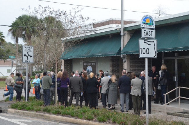 Officials from almost every local government gathered for the ribbon-cutting at the safe house, in what used to be the old Bunnell Post Office. (© FlaglerLive)