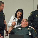 Samatha Whitfield speaking with Flagler County Sheriff's Cmdr. Jeff Stuart during a 2019 meeting, when Whitfield was employed by the Sheriff's Office. (© FlaglerLive)