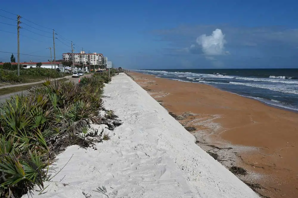 The new sands today south of Flagler Beach.  Workers tried to protect vegetation in some parts, but in others, that proved impossible. (© FlaglerLive)