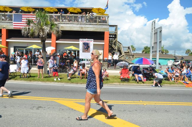 Cooper the dog has drawn a following from advocates who'd rather see the dog sent to a shelter for dangerous dogs on the state's west coast. They demonstrated on his behalf during Flagler Beach's July 4 parade. Click on the image for larger view. (© FlaglerLive)