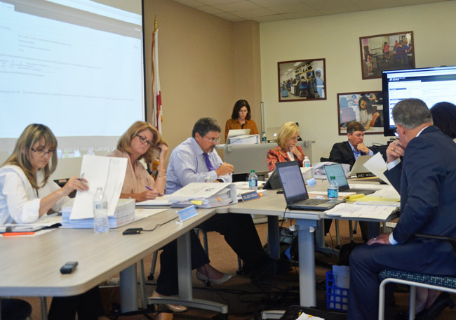 Flagler County School Board members this afternoon choosing the candidates they'll interview on April 20. (© FlaglerLive)