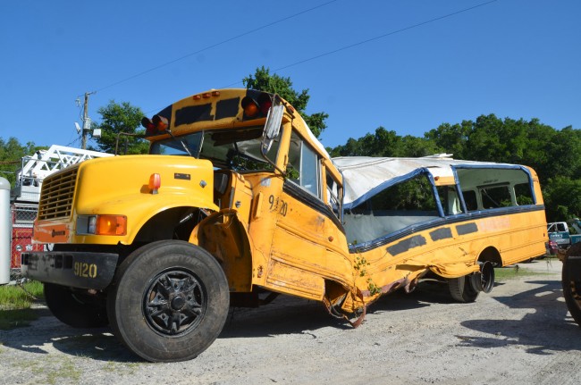 One of the less-damaged of the three school buses. Click on the image for larger view. (© FlaglerLive)