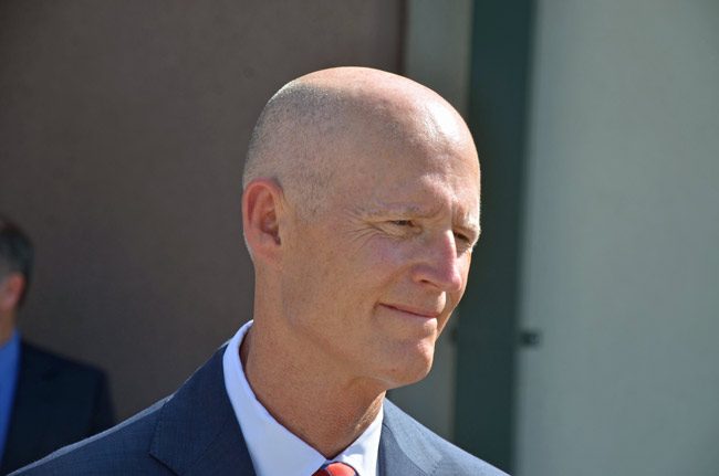 Rick Scott referred to his own experience as he issued an executive order addressing the state's prescription drugs and heroin crisis. (© FlaglerLive)