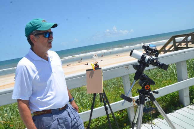 Scott Spradley gets his refracting telescope ready moments before the eclipse. Click on the image for larger view. (© FlaglerLive)