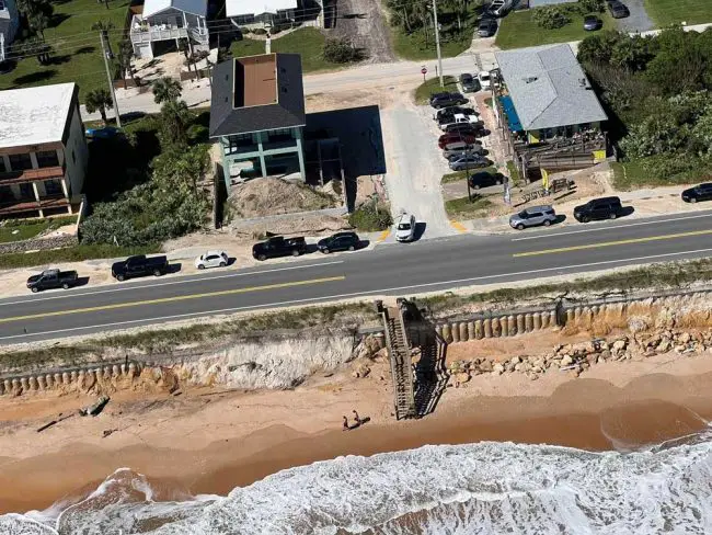 The new sea wall at the north end of Flagler Beach has been exposed again, and looks ugly, but it held. (© FlaglerLive)