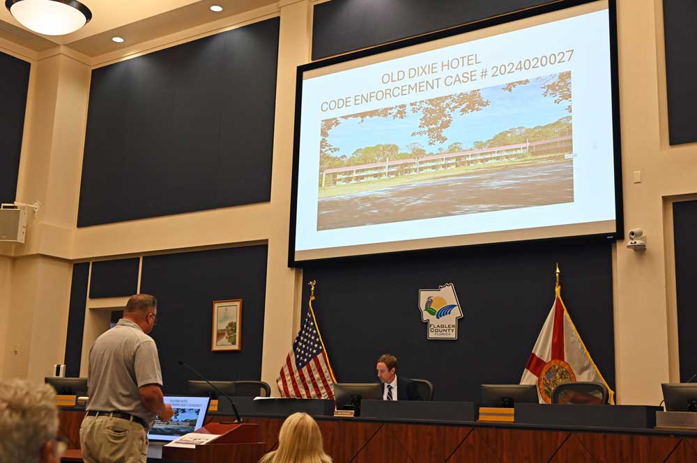 Sean McDermott, a special magistrate, at the beginning of this afternoon's hearing on the Old Dixie motel property. (© FlaglerLive)