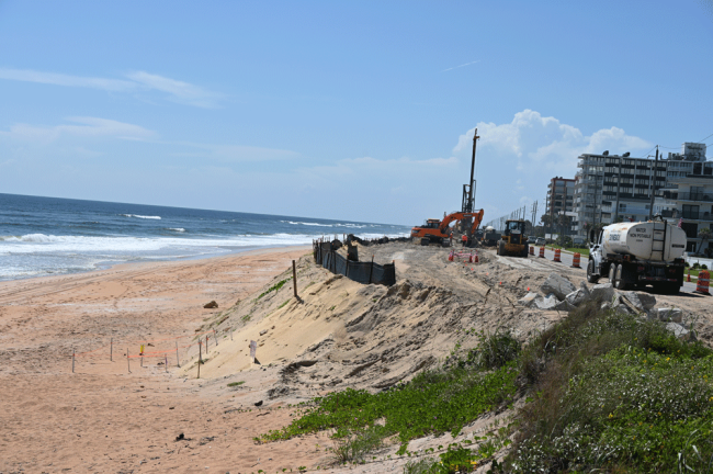 Ongoing construction of a secant seawall toward the south county line, similar to the one at the north end of Flagler Beach. Dunes will cover the wall when completed. (© FlaglerLive) 