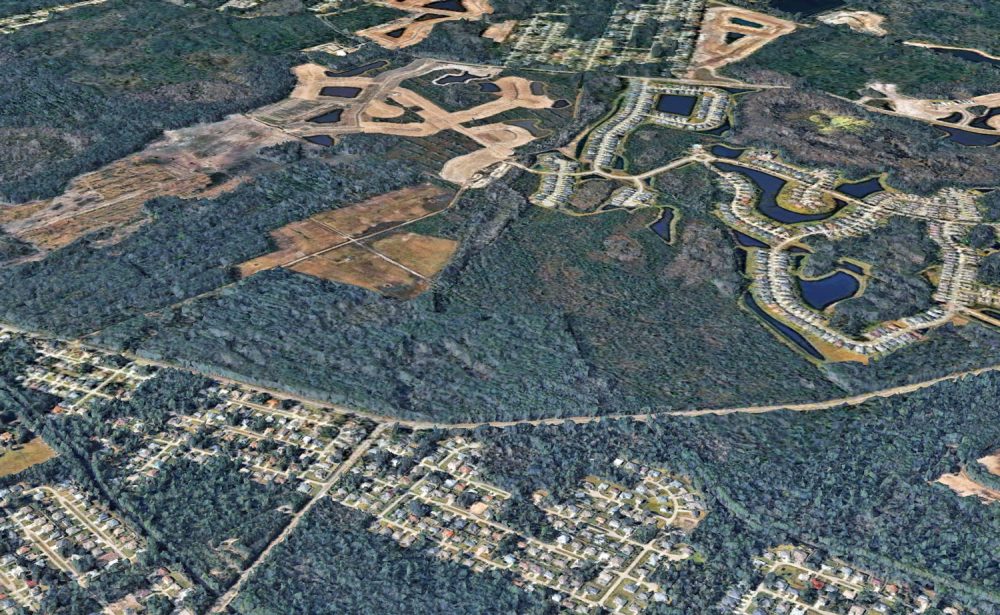 The land of the proposed development, looking west. Seminole Woods Boulevard stretches from left ro right. The ongoing development of Grand Landings, whose residents are objecting to the new development, is to the north. (© FlaglerLive via Goggle Earth)