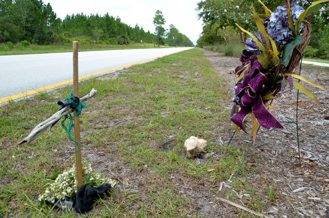 The small roadside memorial where Kirt Smith was struck, on Seminole Woods Boulevard. (© FlaglerLive)