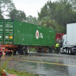 Two of the three semis involved in the crash on I-95 just after noon today, under heavy rain. The crash shut down all southbound lanes. (© FlaglerLive)